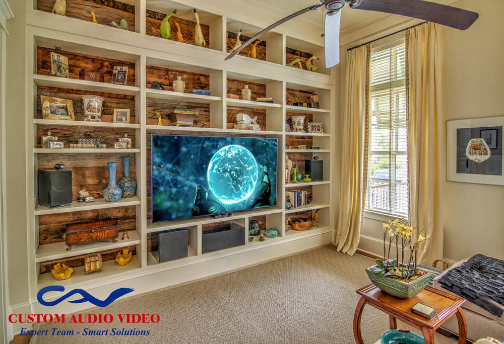 Surround sound system including Bowers & Wilkins 700 Series bookshelf speakers and subwoofer.