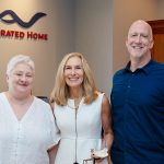 Sandy Benson and guests at the CAV Integrated Home lighting design center grand opening 2024